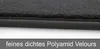A close-up view of the edge of a black car floor mat, showing the texture of the velour material and the stitched edging. Produktbild-Vorschau