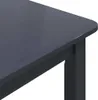 A close-up view of the corner of a dark-colored table. Anteprima dell’immagine prodotto