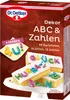 A product box for Dr. Oetker ABC & Zahlen decorations, showing decorated cakes. Produktbild-Vorschau