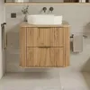 A bathroom vanity with a sink and towels. Anteprima dell’immagine prodotto