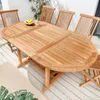 An oval wooden garden table with chairs on a wooden deck. Produktbild-Vorschau
