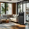 A modern living room with a sectional sofa, coffee table, and a portable air conditioner. Voir les images du produit