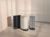 Three pedal bins are displayed in a clean, minimalist setting with soft lighting and shadows. Produktbild-Vorschau