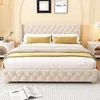 A bedroom scene featuring a tufted bed with yellow accent pillows and a throw blanket. Voir les images du produit