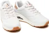 A pair of white Skechers sneakers with rose gold accents and a brown sole, displayed against a white background. Náhled obrázku produktu