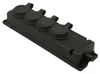 A black electrical multi-socket outlet with four covered sockets and a cable entry point, shown from a diagonal angle on a white background. Anteprima dell’immagine prodotto