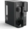 A black water purifier with a glass of water in front of it, set against a white background. Náhľad obrázku produktu