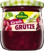 A jar of Kühne Kirsch Grütze with cherries visible inside and on the label. Produktbild-Vorschau
