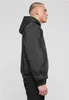 A man wearing a black hooded jacket and black jeans, shown from the side against a white background. Produktbild-Vorschau
