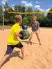 Two children playing with boxing gloves on a sand court. Produktbild-Vorschau