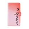 A pink and red gradient phone case with the word "smile" and hearts printed on it. Produktbild-Vorschau
