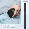 A person is placing a black phone case into their jeans pocket. Podgląd zdjęcia produktu