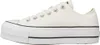 A side view of a white Converse Chuck Taylor All Star Lift Ox sneaker with a platform sole. Voir les images du produit