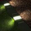 Garden border lights illuminating grass and gravel. Produktbild-Vorschau