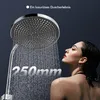 A woman is showering under a large showerhead, with water flowing down. Text indicates the size of the showerhead. Podgląd zdjęcia produktu