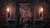 A dark, gothic-style door with intricate carvings of a demonic figure, flanked by torches. Produktbild-Vorschau