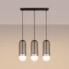 A product shot of a black pendant light fixture with three globes. Podgląd zdjęcia produktu