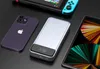 A power bank, smartphone, tablet, and gaming console are arranged on a black surface. Náhled obrázku produktu