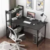 A black computer desk with shelves, a computer, and a chair in a room. Podgląd zdjęcia produktu