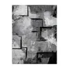 A rug with an abstract geometric design in shades of gray and black. Produktbild-Vorschau
