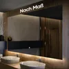 A modern bathroom vanity with two sinks and a large illuminated mirror. Produktbild-Vorschau