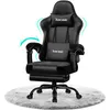 A black gaming chair with a footrest is shown on a fluffy rug. Voir les images du produit