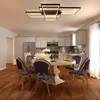 A modern dining room and kitchen area with a geometric ceiling light. Náhľad obrázku produktu