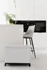 A modern kitchen setting with a white trash bin and a bar stool. Náhľad obrázku produktu