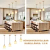 A split image showing a kitchen island with pendant lights and stools, and a separate display of pendant lights with text. Produktbild-Vorschau