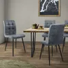 A dining room setting with chairs around a table. Náhled obrázku produktu
