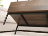 Close-up view of the underside of a wooden coffee table with black metal legs. Náhled obrázku produktu