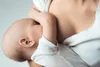 A close-up shot of a baby breastfeeding. Podgląd zdjęcia produktu
