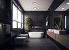 A modern, luxurious black bathroom with a freestanding bathtub, two toilets, a vanity with sinks, and lush green plants. Náhľad obrázku produktu