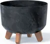 A dark, round planter with a marbled effect sits on three angled legs. Anteprima dell’immagine prodotto