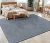 A bedroom scene with a bed, rug, and furniture. Anteprima dell’immagine prodotto