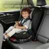A young child sits in a car seat in the back of a car, holding a teddy bear. Náhled obrázku produktu