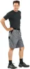 A man wearing shorts and a t-shirt, standing against a white background. Produktbild-Vorschau