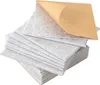 A stack of square, light gray acoustic panels with one panel peeled back to reveal a brown adhesive backing. Náhled obrázku produktu