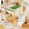 A child's loft bed with a desk and stairs, decorated with stuffed animals and a cloud-shaped light. Produktbild-Vorschau