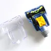 A disassembled vacuum cleaner brush head and its transparent cover are laid out on a white surface. Voir les images du produit