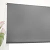 A person's hands are shown adjusting a gray roller blind. Anteprima dell’immagine prodotto
