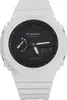 A white Casio G-Shock watch with a black face is shown against a white background. Produktbild-Vorschau