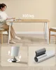 A woman sitting at a table, with close-ups of table leg features. Produktbild-Vorschau
