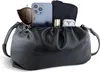 A black leather pouch bag with its contents displayed. Produktbild-Vorschau