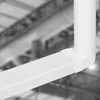A close-up view of a white plastic ventilation duct elbow connector. Podgląd zdjęcia produktu