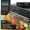 A collage image advertising a food dehydrator, showing the appliance and various dried fruits and vegetables. Náhled obrázku produktu