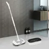 A modern bathroom with a tiled wall, a vanity with a sink and mirror, and a floor with a cleaning mop and a cleaning basin. Produktbild-Vorschau