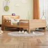 A child's bedroom with a wooden bed, toys, and decorations. Voir les images du produit