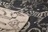 A close-up view of a folded blanket with a safari animal print. Produktbild-Vorschau