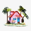 A model of Kame House from Dragon Ball, complete with palm trees, a turtle, and Master Roshi. Produktbild-Vorschau